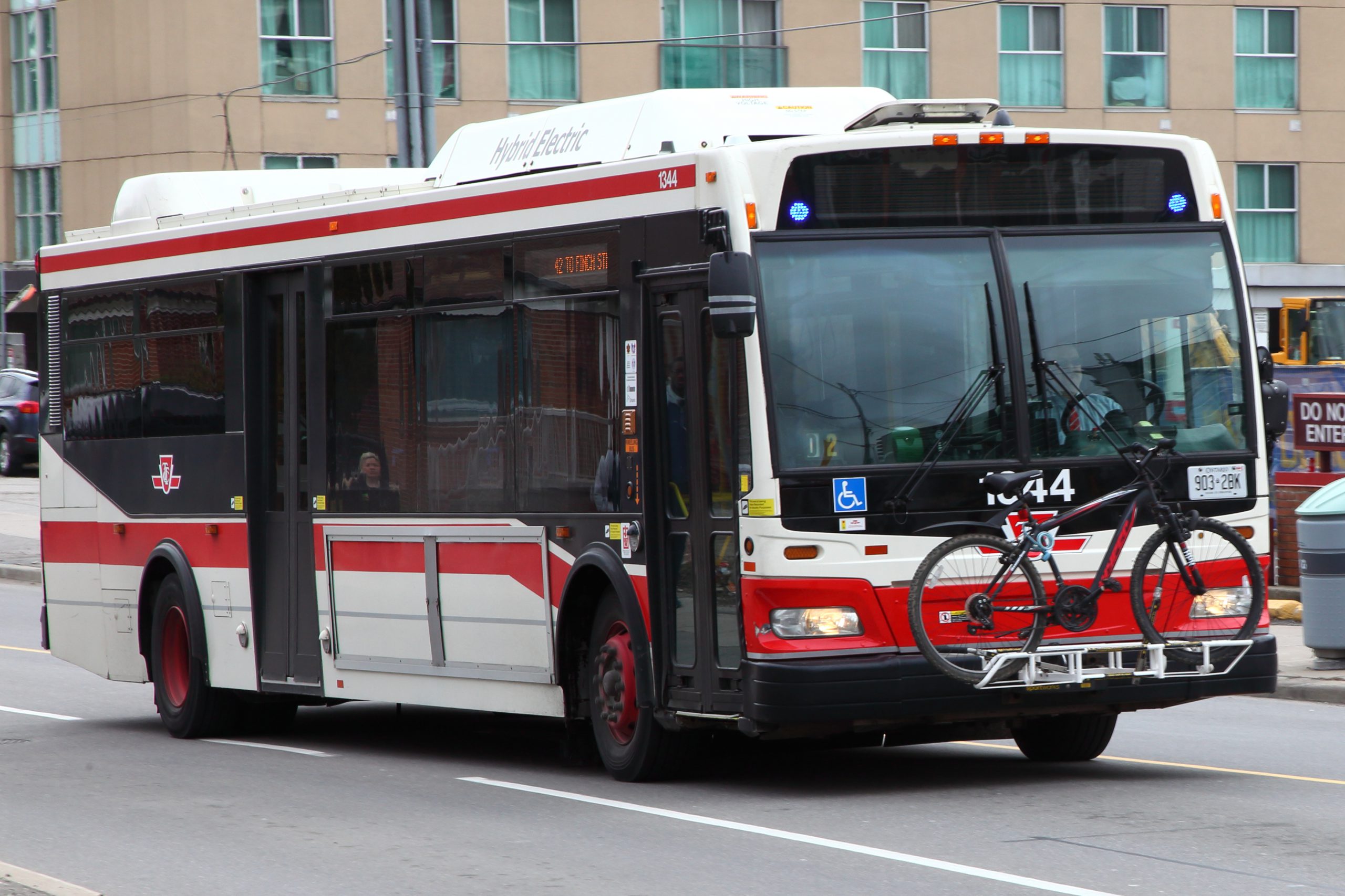 A bike rack on the front of a Toronto bus.