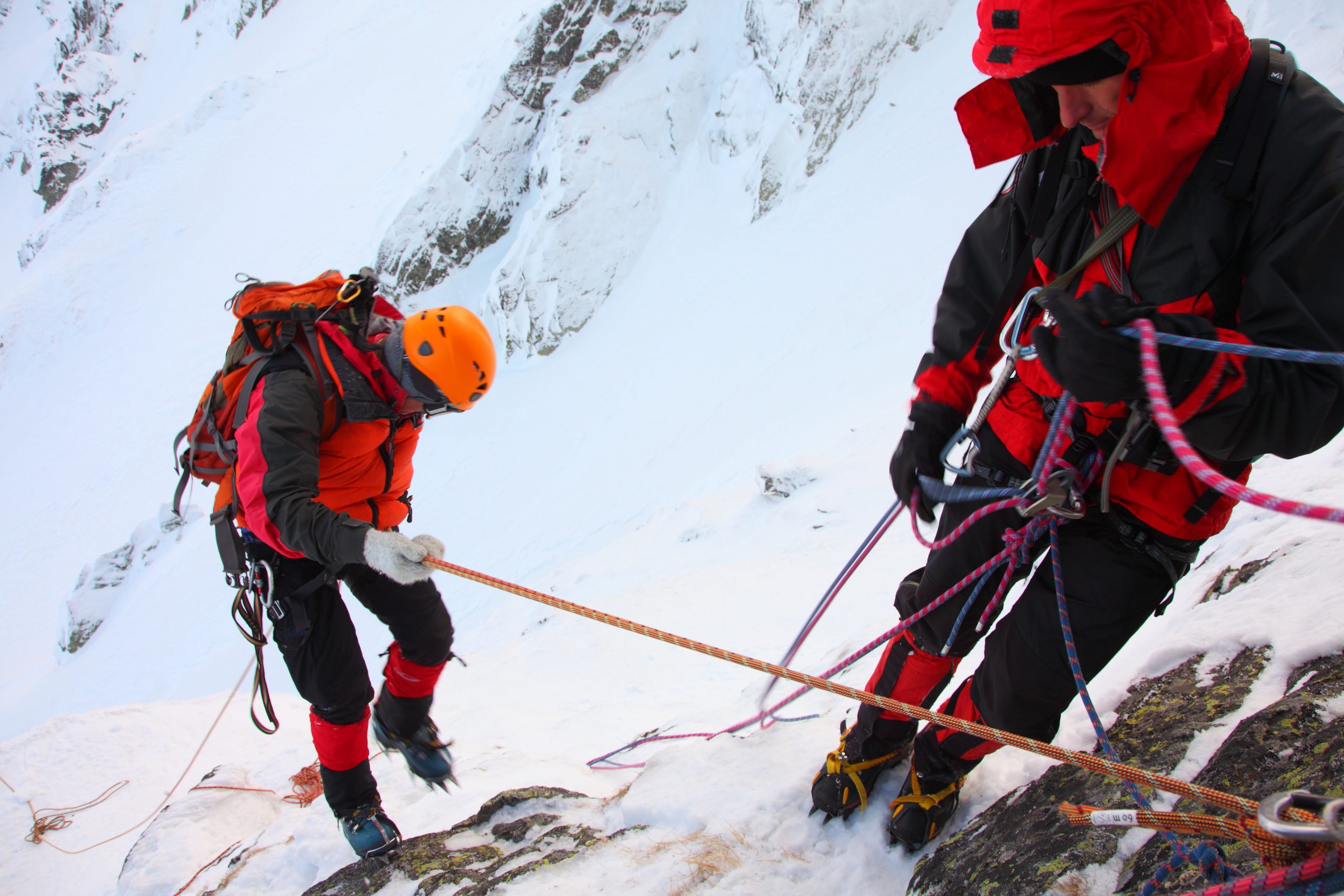 Two individuals ice hiking