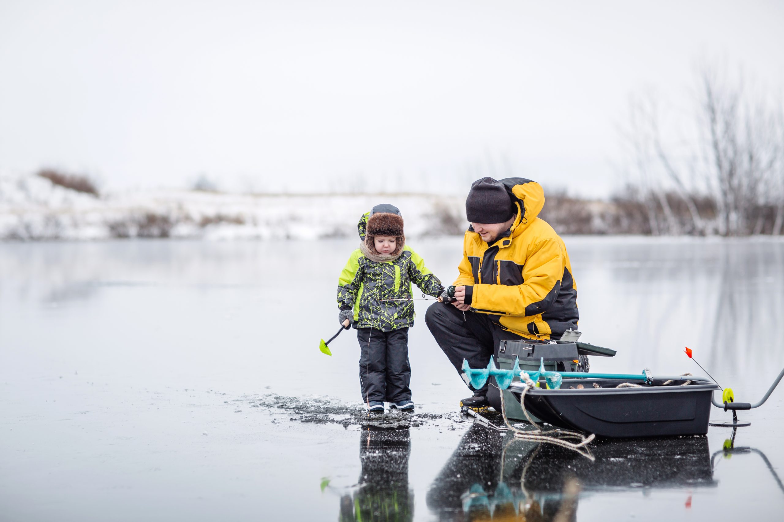 Father and son ice fishing